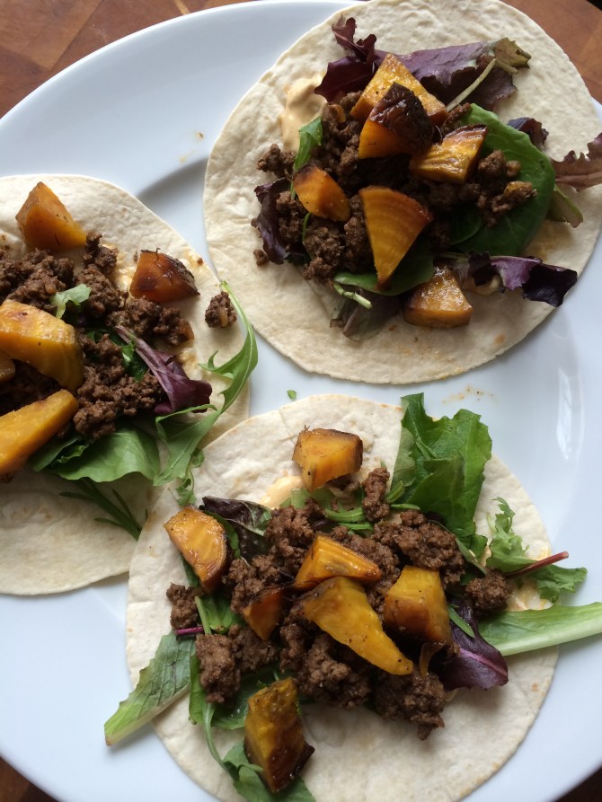 Tacos with roasted golden beets, baby Romaine salad mix, and Awesomesauce