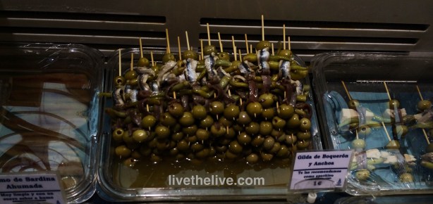 Our favorite tapas when in Spain: a skewer of olives, peppers and anchovies. 