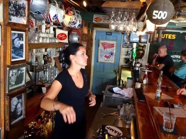 Our lovely server at The Ramp. Notice photos of former Presidents behind her.