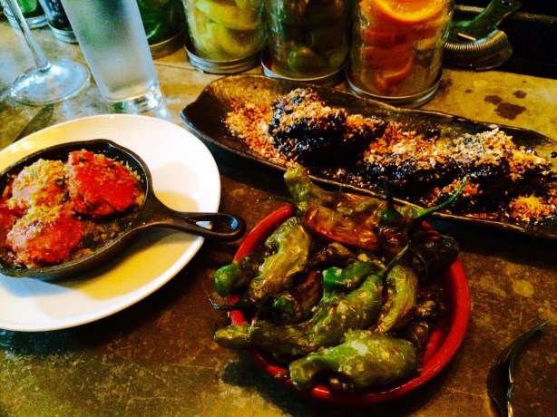 Small plates: meatballs, chicken wings with sesame and squid ink, shishito peppers.