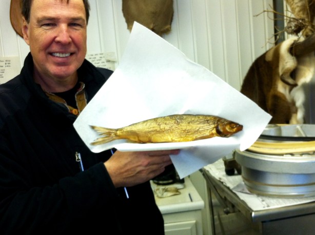 Buying whitefish at one of many smoke shacks at the foot of the Mackinac Bridge, which connects the Lower Peninsula to the Upper Peninsula of Michigan.
