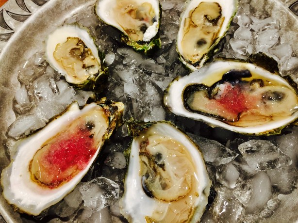 Fresh shucked oysters with pickled red onion ice.